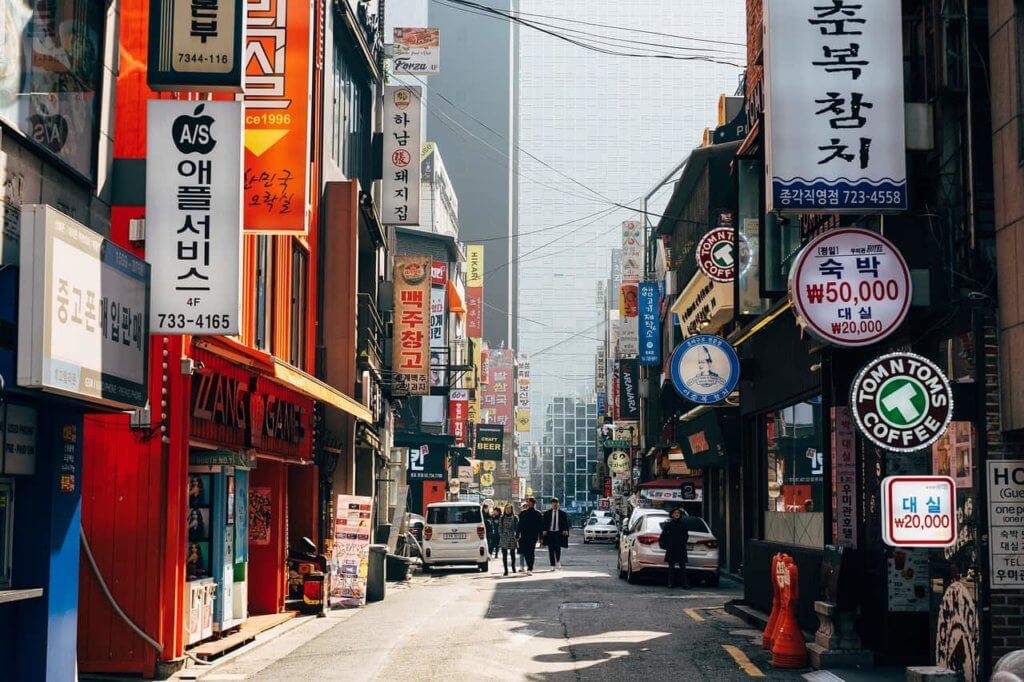 A South Korean street flanked by signs in the Korean language