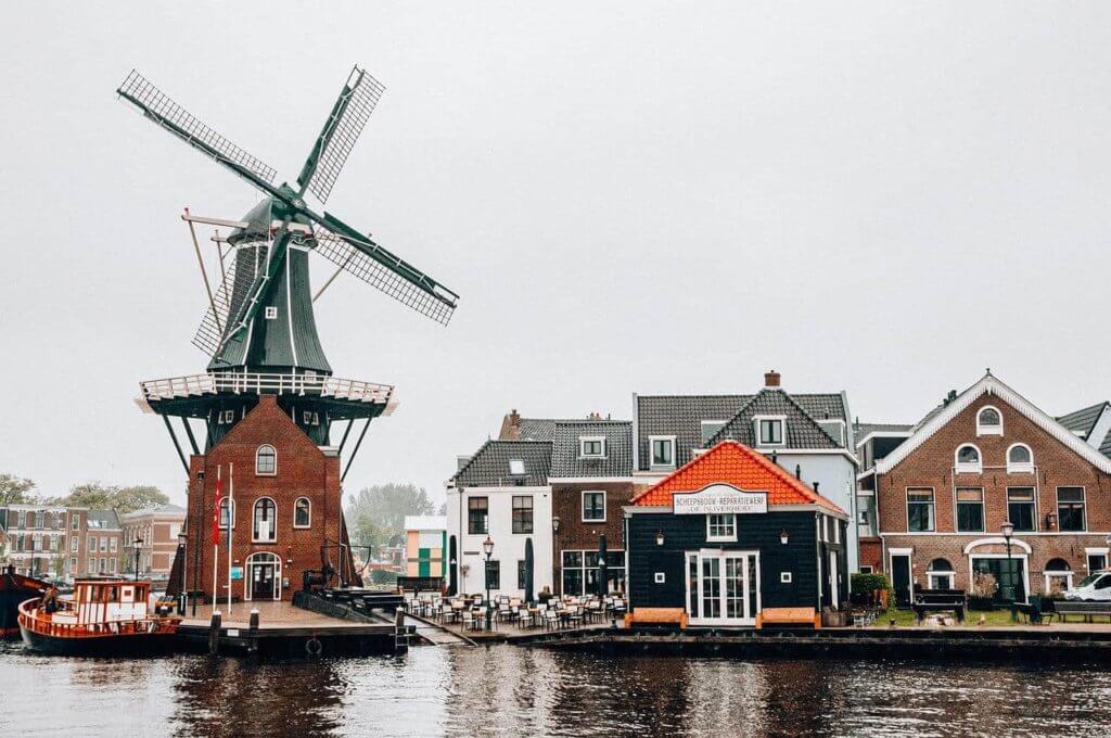 An old windmill oversees the landscape of a Dutch city