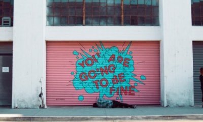 Graffiti consisting of an aqua blue plaint splash with the words you are going to be fine in red
