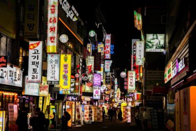 The neon-lit city of Seoul vibrates with the evening's life